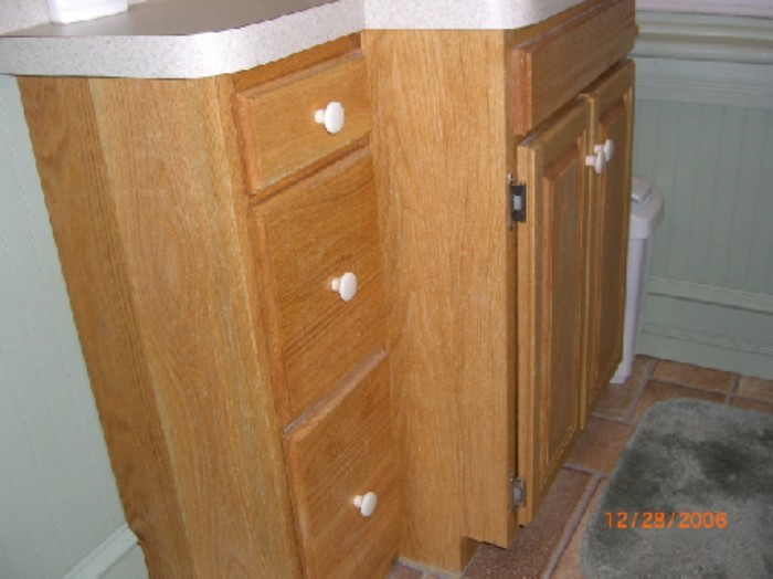 photo of a bathroom vanity made of red oak