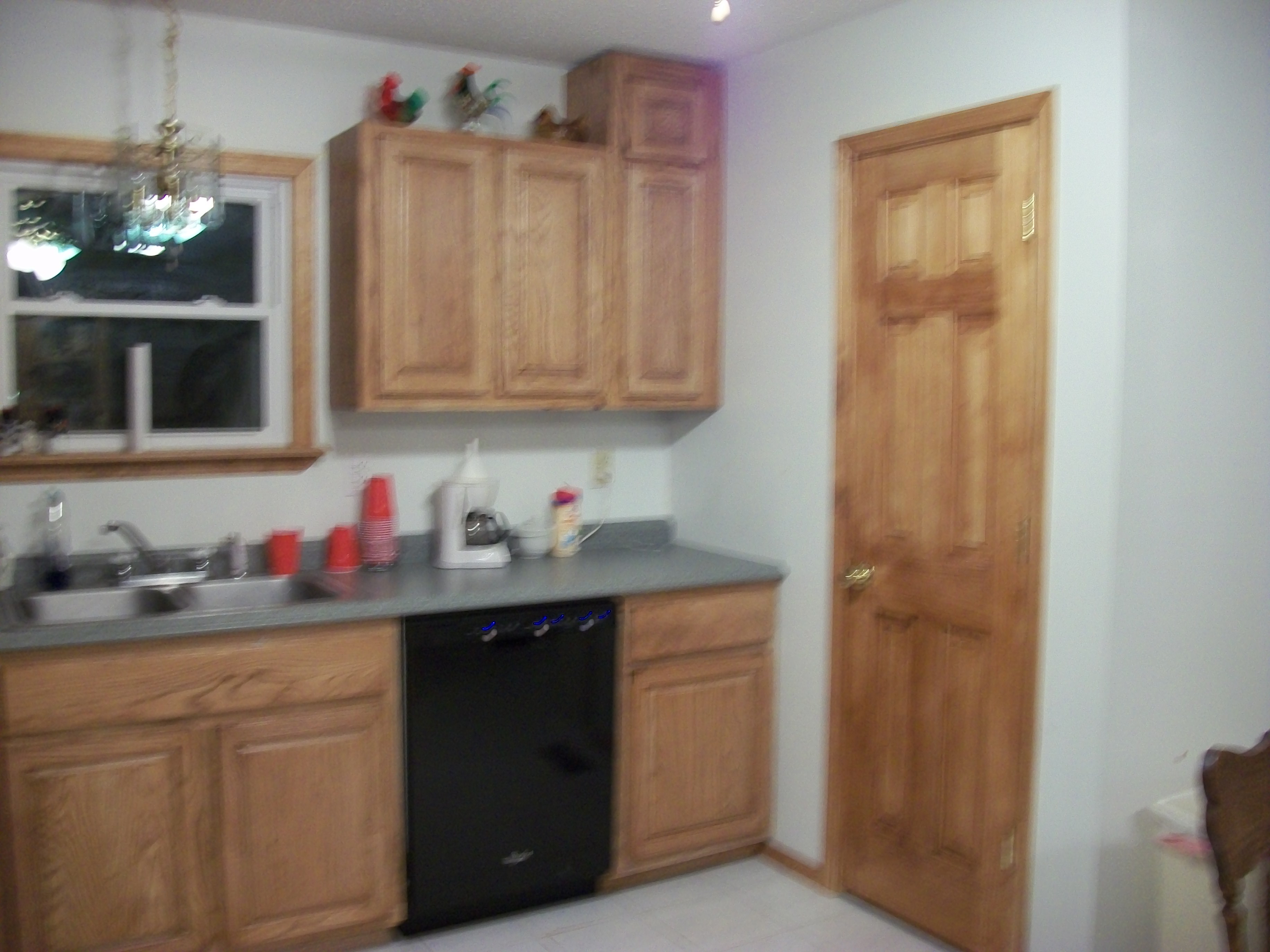 photo of kitchen cabinets made of red oak