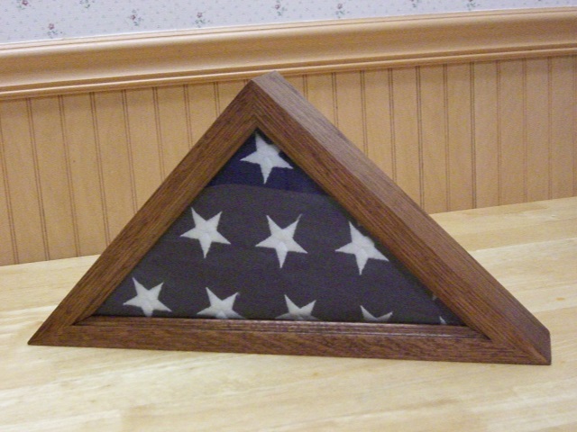 photo of a us flag display case with flag inside